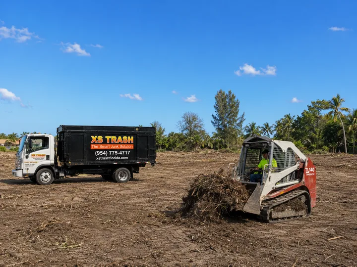 Lot clearing service with XS Trash crew and equipment in South Florida