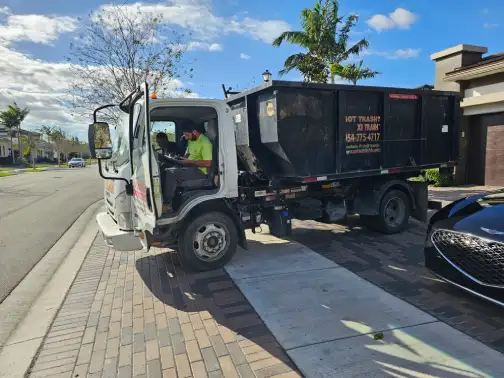 Crew performing an estate furniture cleanout with organized loading